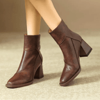 Brown ankle boots with block heel and pointed toe, side zipper with pull tab