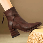 Brown ankle-fit block heel boots with stitched panels and side tassel pull tab