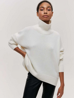 White knitted turtleneck sweater with long sleeves and ribbed collar