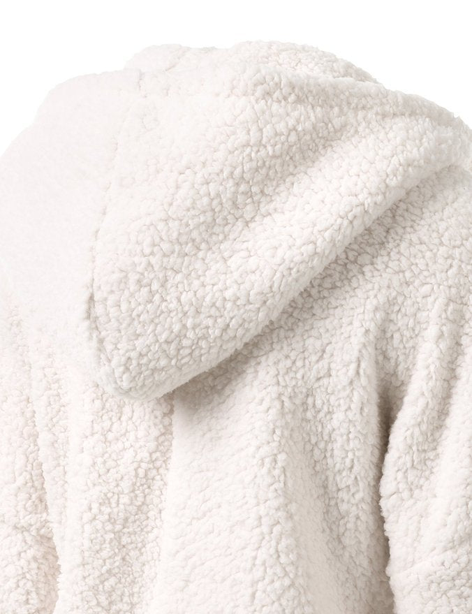 White sherpa fleece hooded jacket close-up of padded shoulder and hood