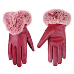 Burgundy leather gloves with fluffy pink faux fur cuffs and five-finger stitching.