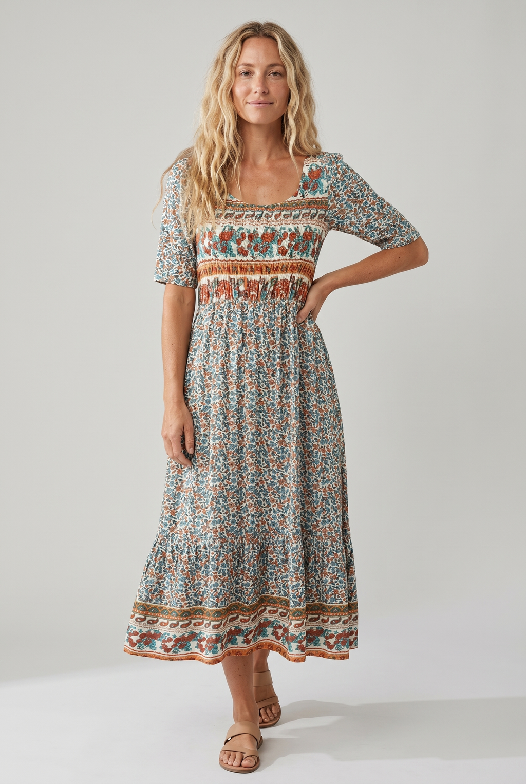 Boho print midi dress with short sleeves, smocked waist, and decorative border hem