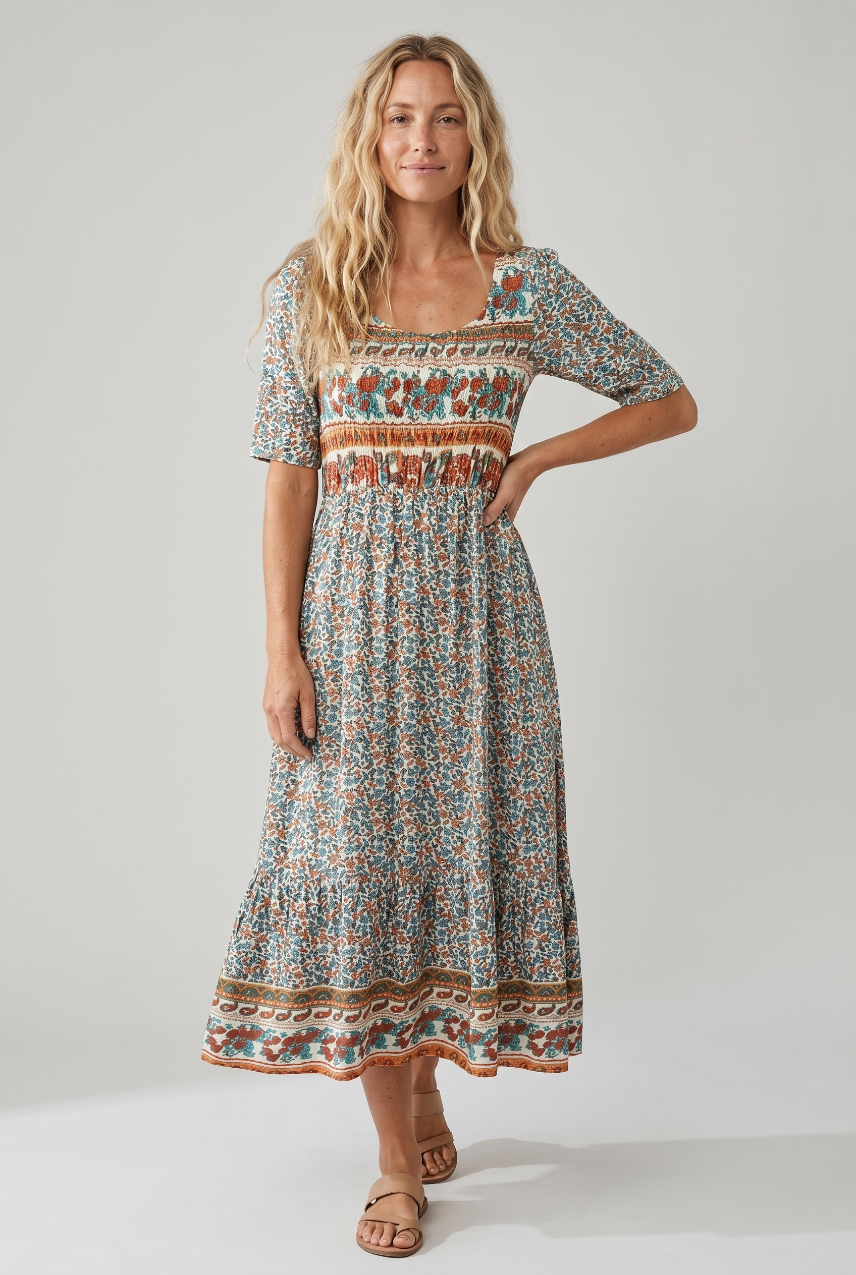 Boho print midi dress with short sleeves, smocked waist, and decorative border hem