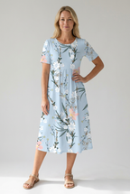 Light blue floral midi dress with short sleeves and gathered waist, keyhole neckline