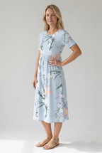 Light blue floral midi dress with short sleeves, gathered waist, scoop neckline