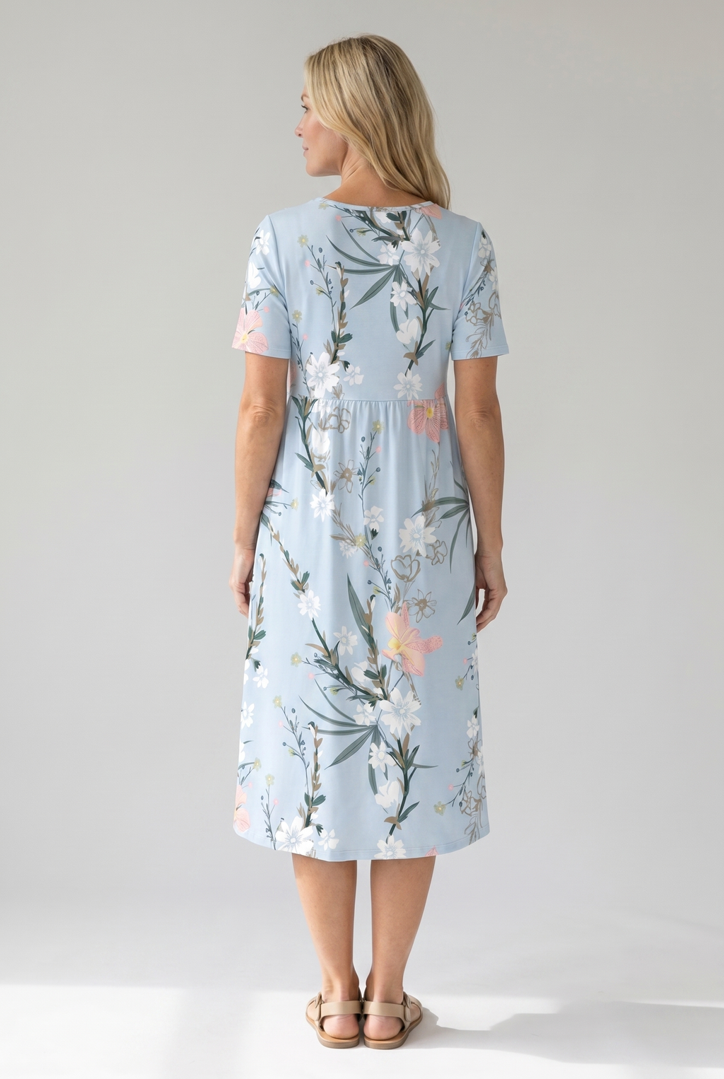 Light blue floral midi dress, back view with short sleeves and midi length