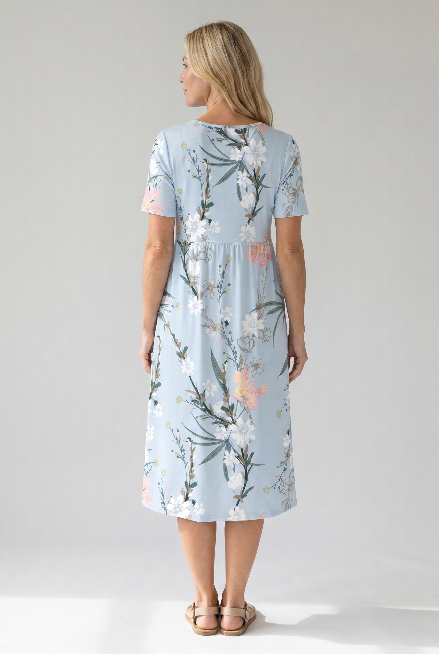 Light blue floral midi dress, back view with short sleeves and midi length