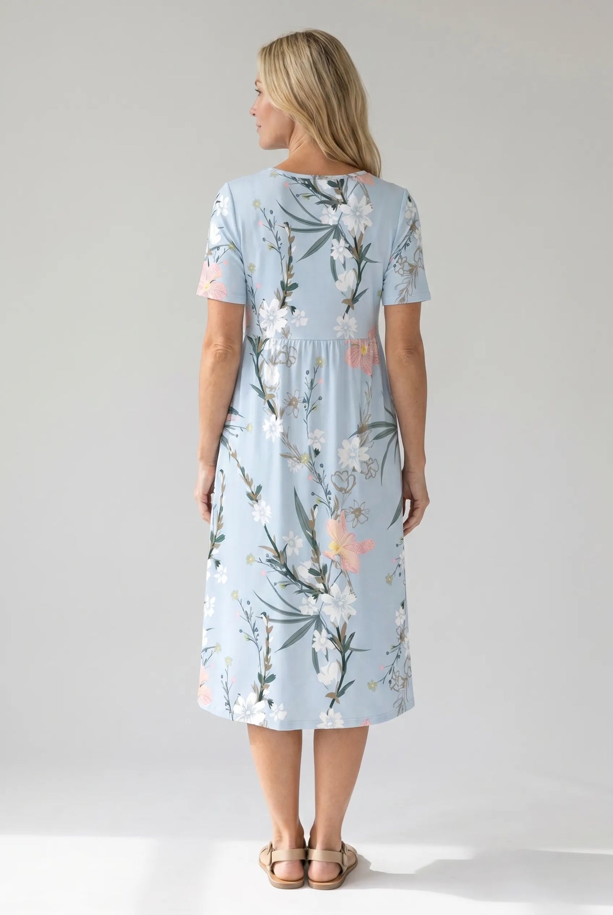 Light blue floral print midi dress, back view, short sleeves, A-line silhouette.