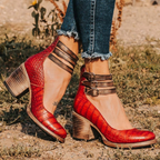 Red snake-embossed leather ankle-strap shoes with buckle straps and block heel.