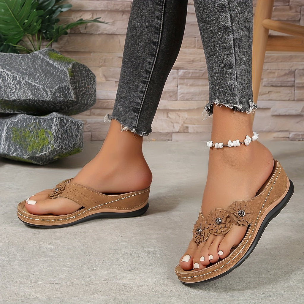 Women's wedge sandals in tan/brown with flower details and beaded ankle strap