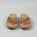 Women's wedge sandals in tan with flower applique on thong-style straps