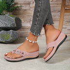 Women's wedge sandals in dusty pink with flower appliques and beaded ankle strap