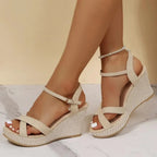 Beige wedge sandals with ankle strap and buckle detail