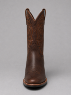 Brown leather cowboy boots with ornate stitched V-top and decorative shaft