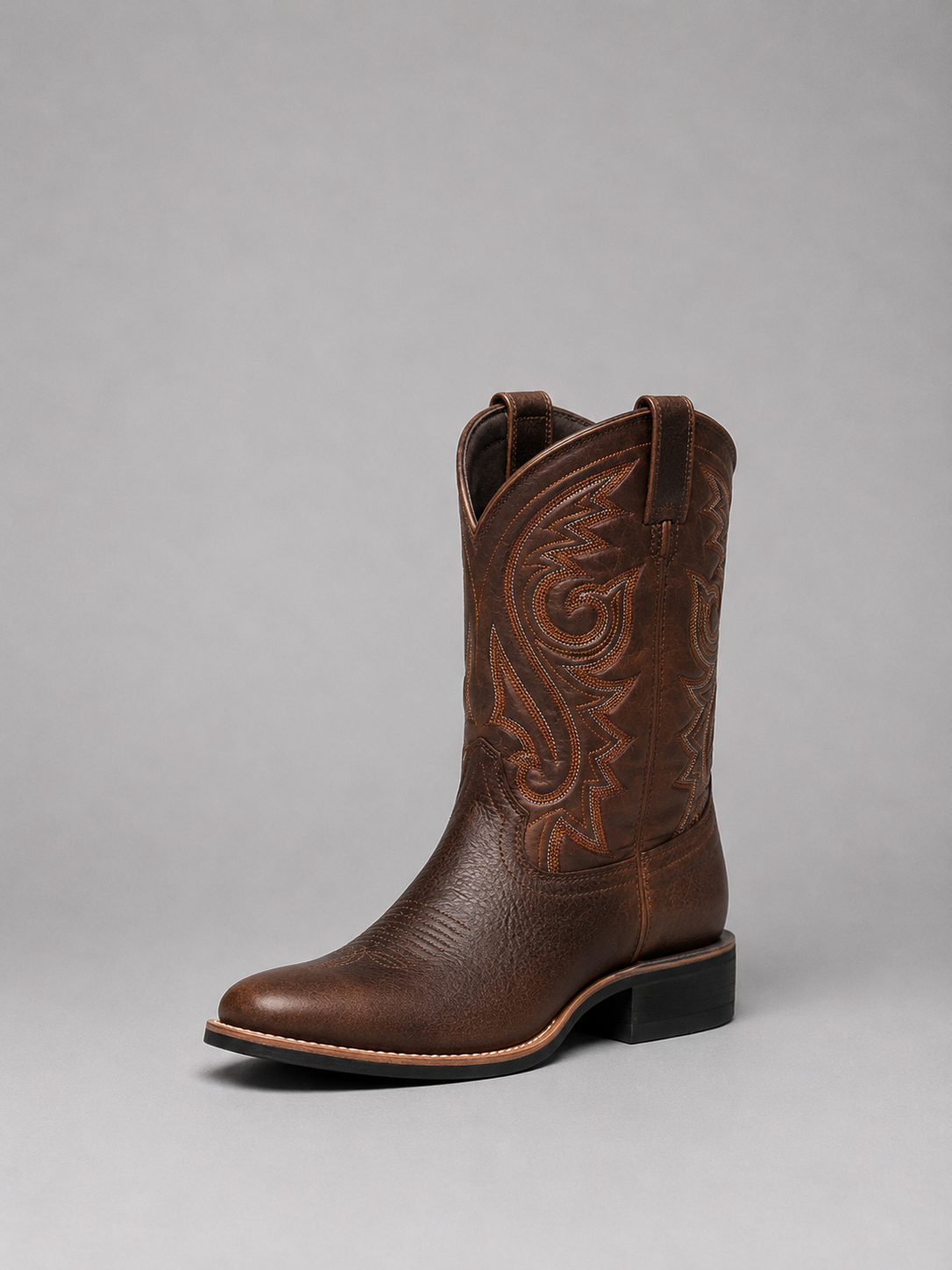 Brown leather cowboy boots with side embroidery and low block heel