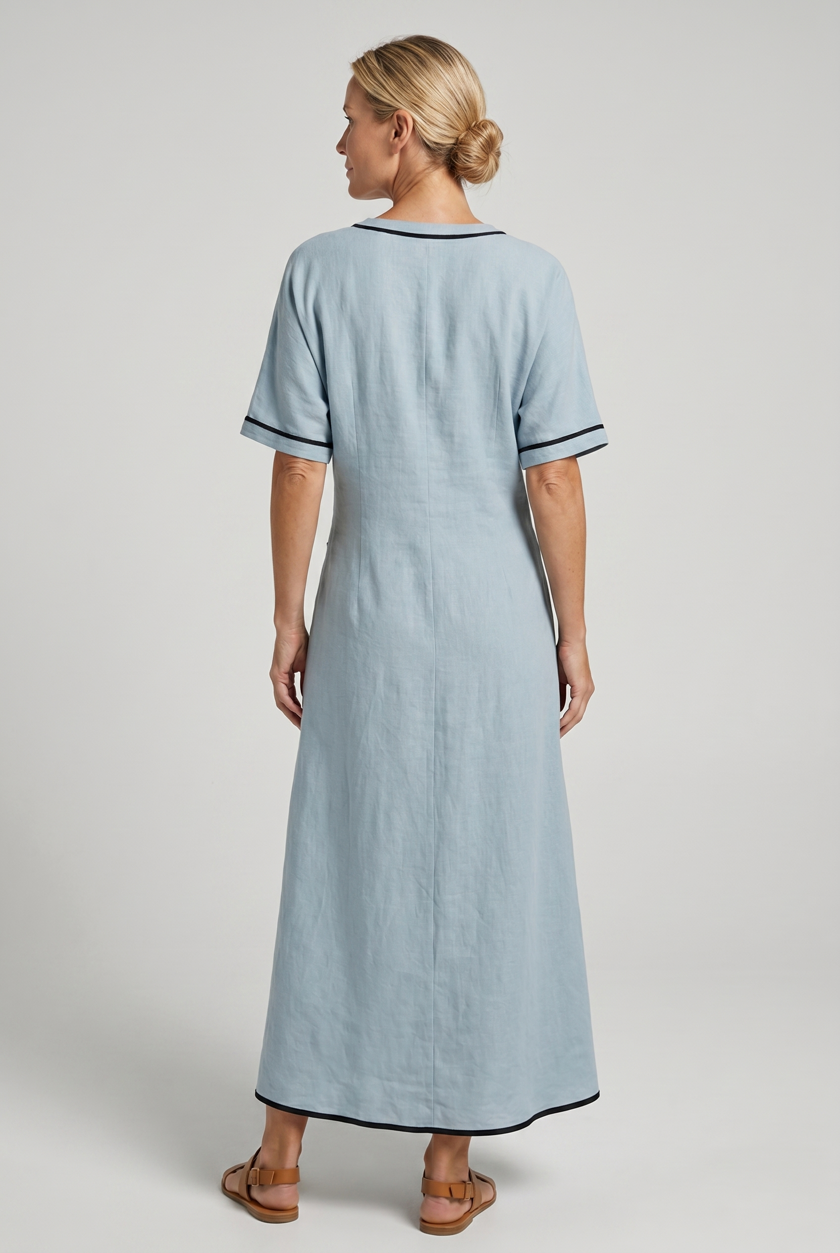 Blue maxi summer dress, back view with V-neck twist-front knot and black trim