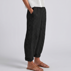 Dark striped trousers with side button placket, relaxed fit, ankle length