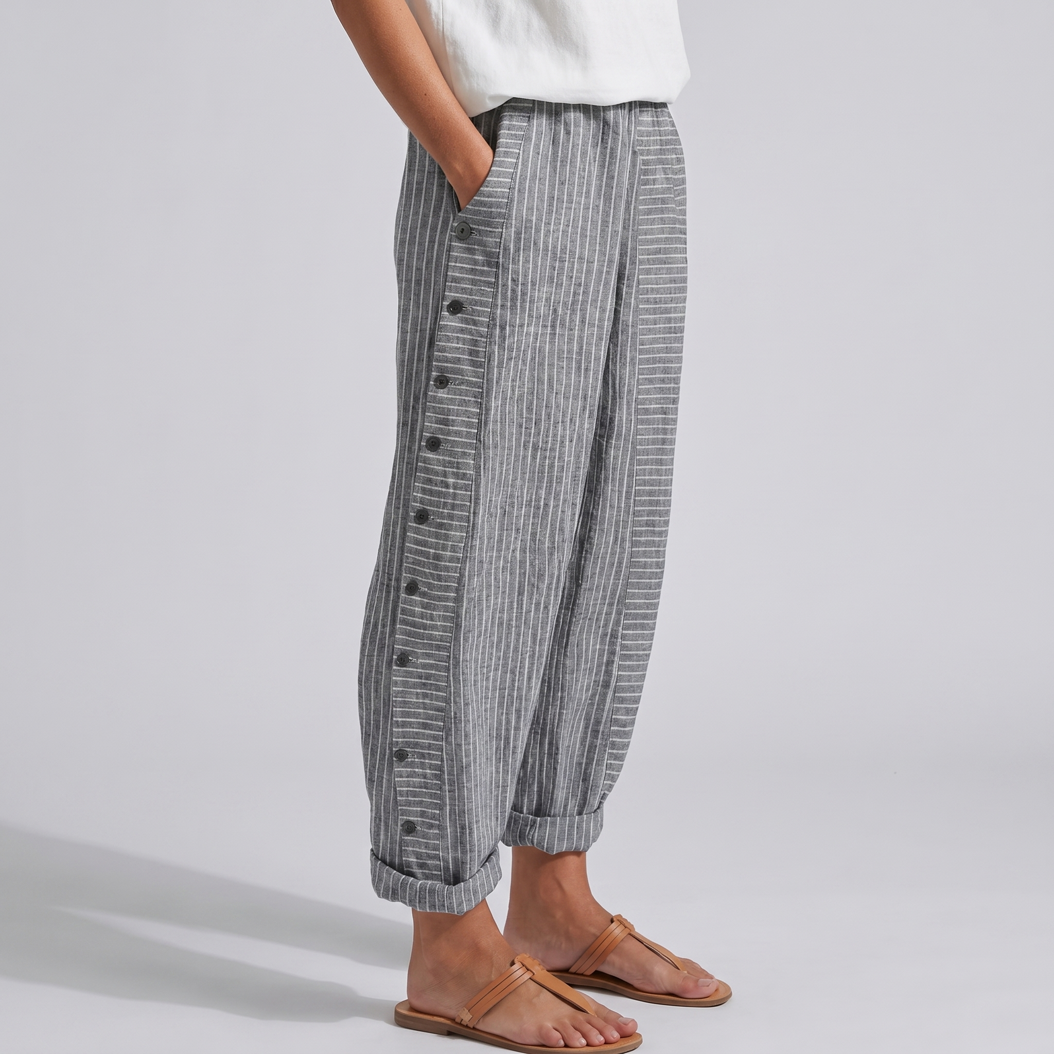 Grey striped trousers with side button placket, relaxed fit, ankle length