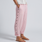 Pink striped trousers with side button placket, relaxed fit, ankle length