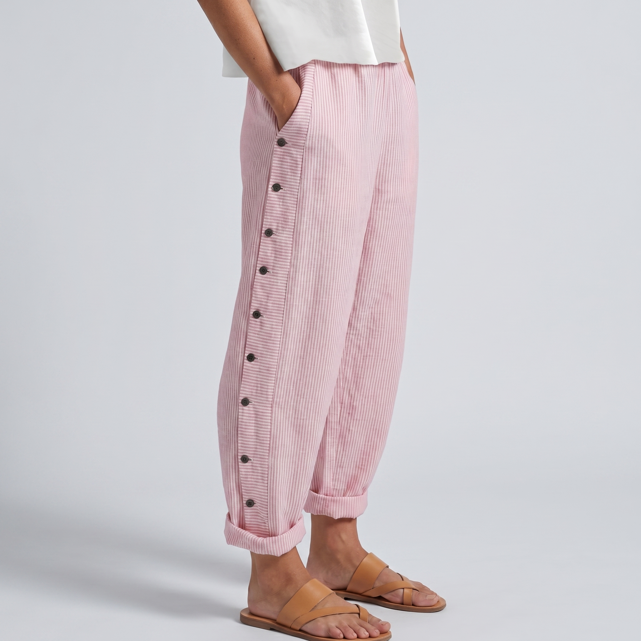 Pink striped trousers with side button placket, relaxed fit, ankle length