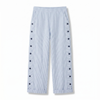 Women’s light blue striped trousers with button-trim panels along the sides